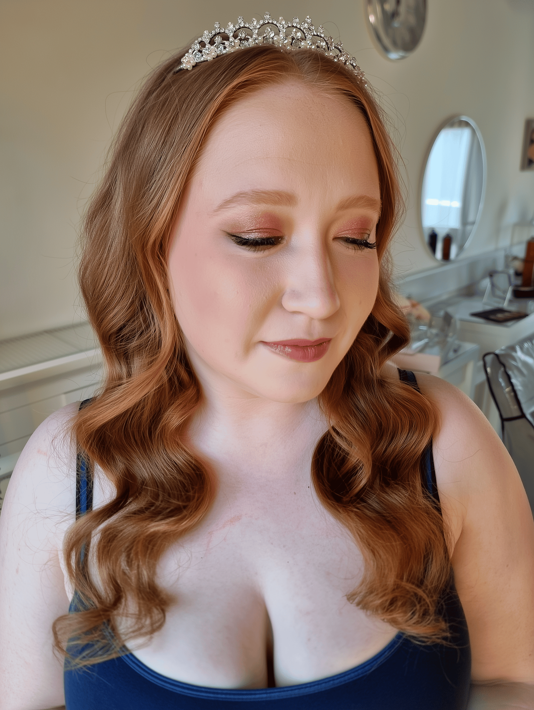 Elegant bride Amber photographed at Wadhurst Castle after her bridal hair and makeup styling by Glamour Brides.