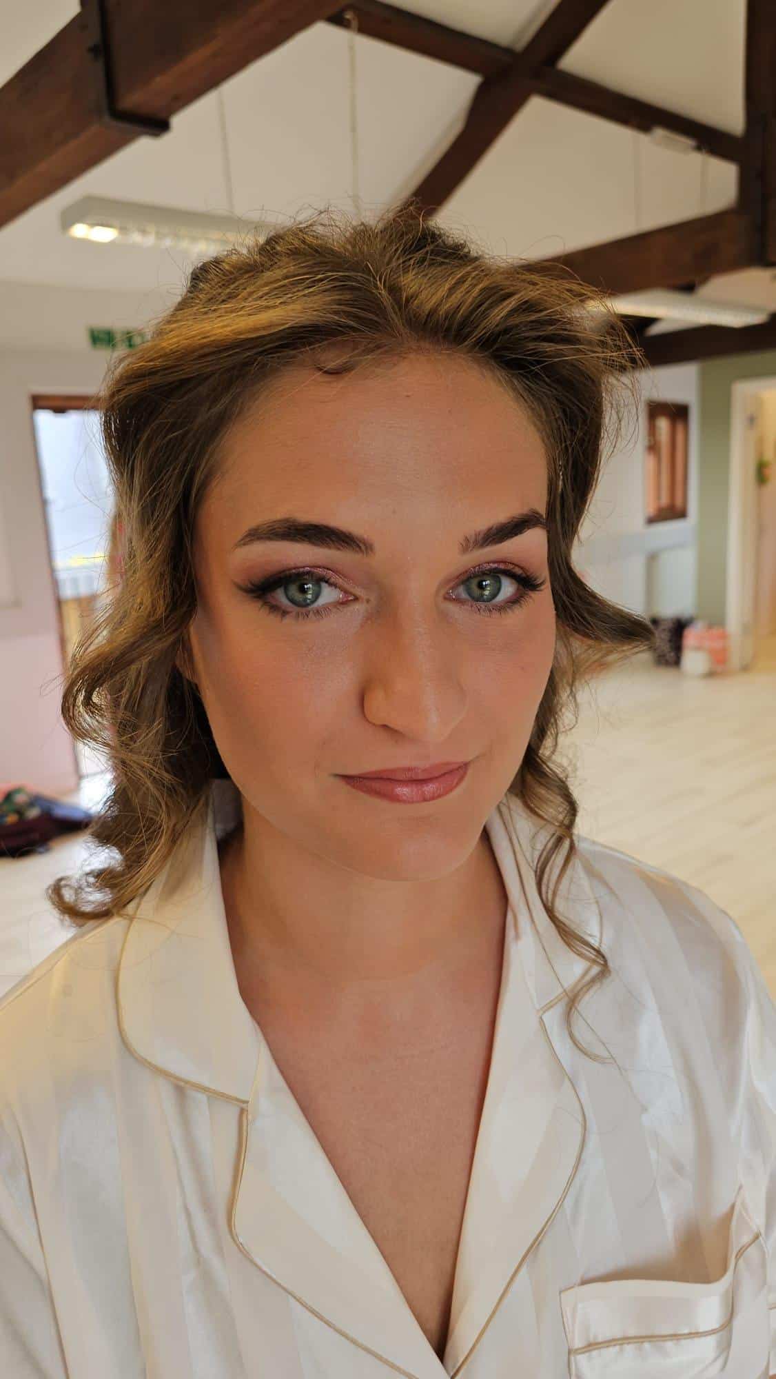 Celia’s Bridal Hair and Makeup at The Secret Garden Venue Celia’s bridal portrait at The Secret Garden featuring timeless bridal hairstyle and natural makeup by Glamour Brides.