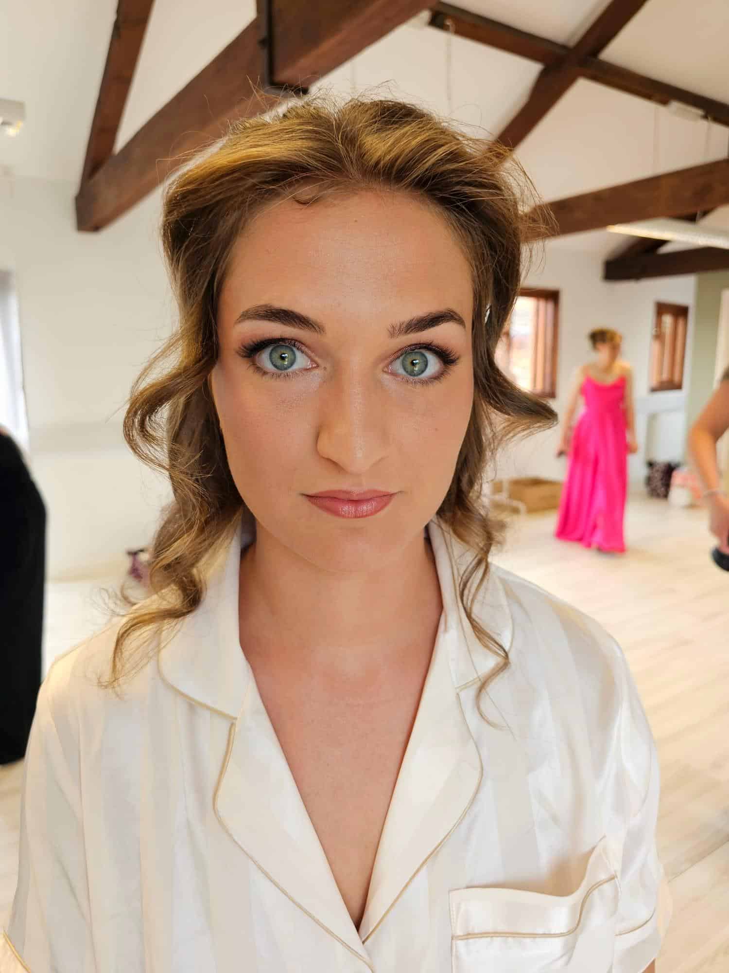 Bride Celia Preparing for Her Wedding at The Secret Garden Celia on her wedding day at The Secret Garden venue in Kent with bridal hair and makeup created by Glamour Brides.