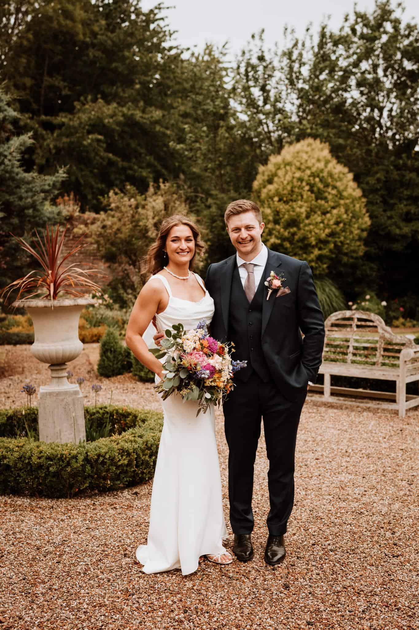 Celia’s Romantic Wedding Day Look at The Secret Garden Celia photographed in the gardens of The Secret Garden wedding venue with bridal hair and makeup styled by Glamour Brides.
