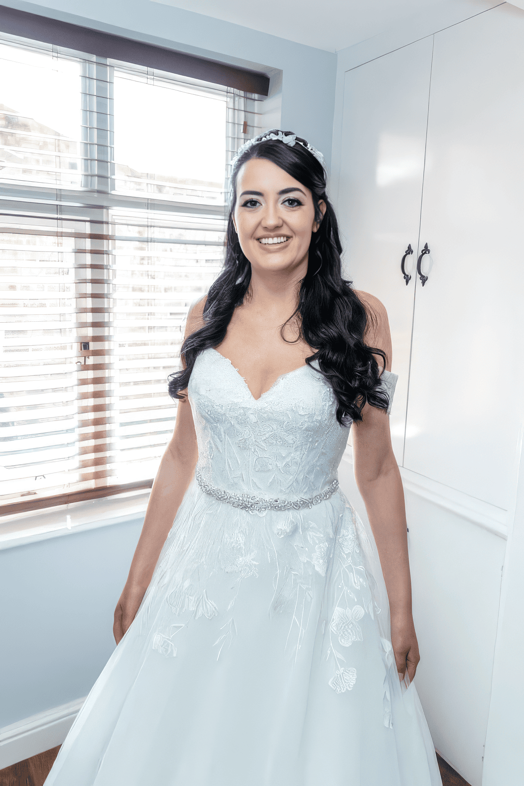 glamour-brides-claire-salomons-estate-kent-romantic-hairstyle.jpg Bride smiling in natural light with soft glam makeup at Salomons Estate