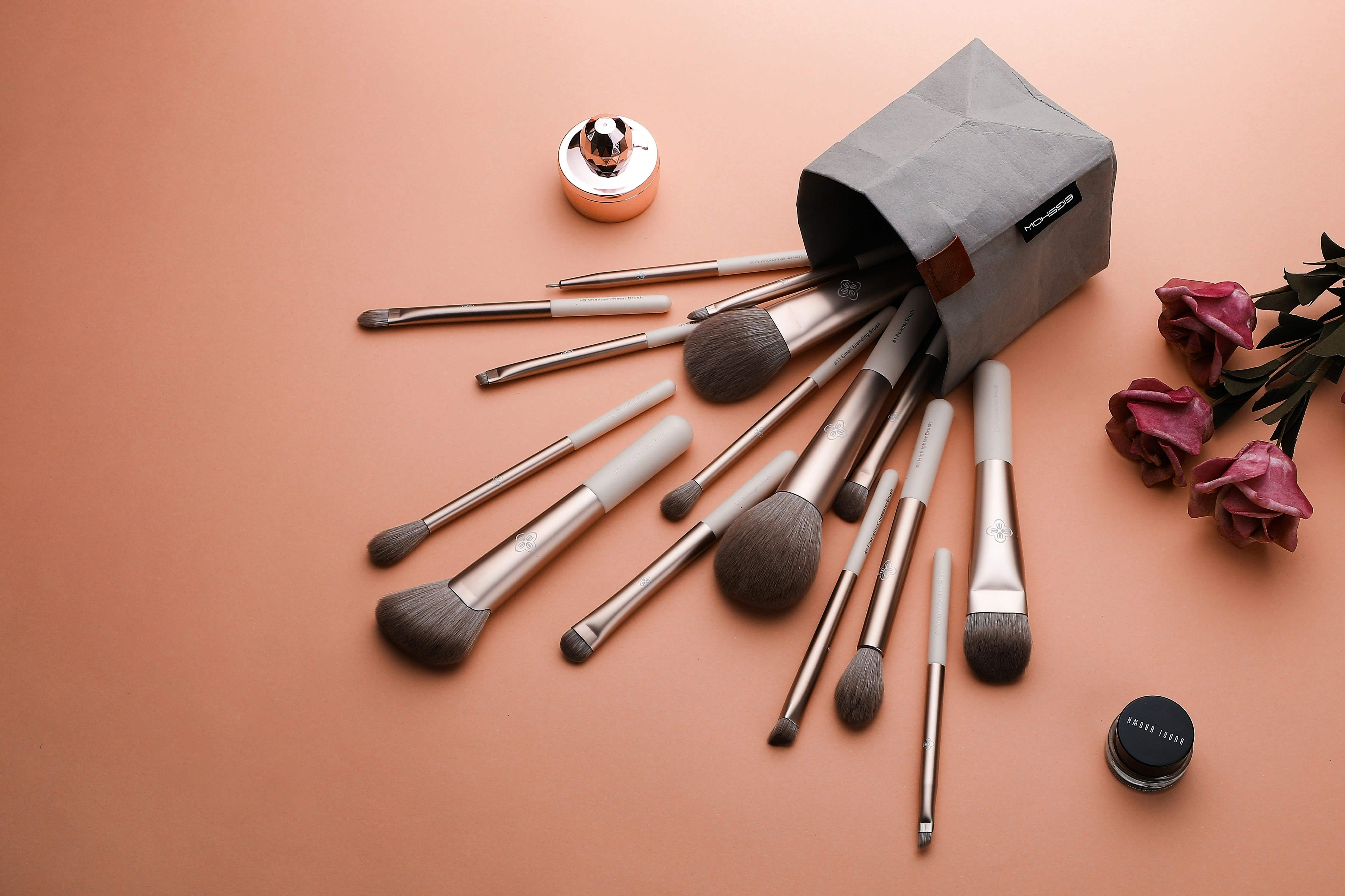 soft-glam-bridal-makeup-wedding-look.jpg Professional makeup brushes spilling from a beauty kit used for bridal hair and makeup styling.